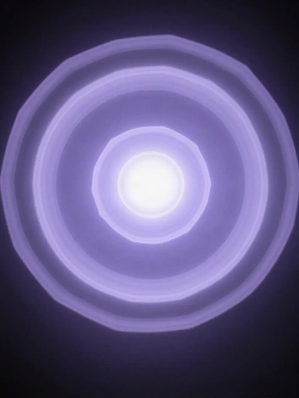 Concentric rings of violet light around a bright core